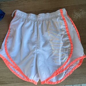 Nike White and Pink Athletic Shorts with Curved Hem